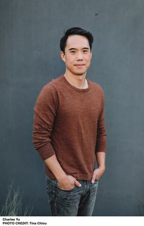 Photo of Charles Yu wearing a Brown long sleeved shirt and smiling 